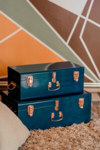 photo of navy blue trunks sitting on top of each other